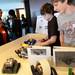 Lenawee Intermediate School District Tech Center students Evan Darrach and Nathan Underhill show off their team's robots to other students during Michigan Robotics Day at the Jack Roth Stadium Club at Michigan Stadium on Monday, April 15, 2013. Melanie Maxwell I AnnArbor.com